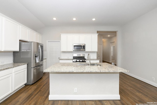 kitchen with white cabinetry, a sink, tasteful backsplash, and appliances with stainless steel finishes