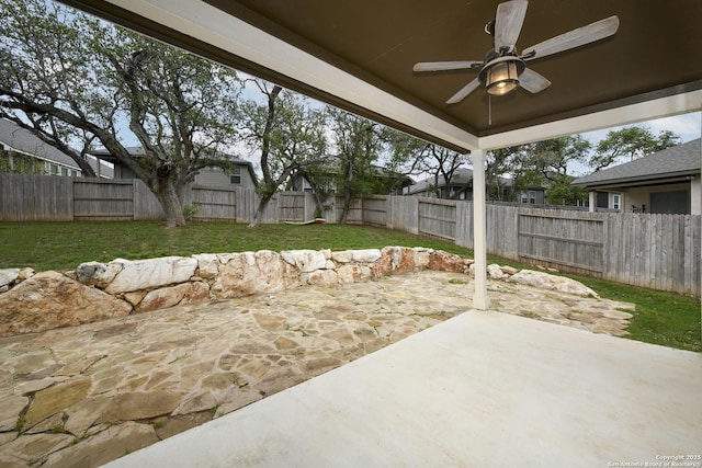 view of patio / terrace with a fenced backyard and ceiling fan