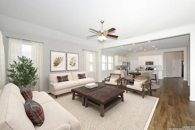 living area with a ceiling fan, recessed lighting, a healthy amount of sunlight, and dark wood finished floors