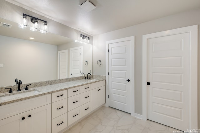 122 Hi Vw, Lakehills, TX 78063 - bathroom featuring marble finish floors and double vanity