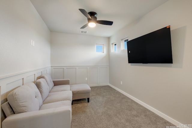 122 Hi Vw, Lakehills, TX 78063 - living area featuring ceiling fan, carpet, and wainscoting