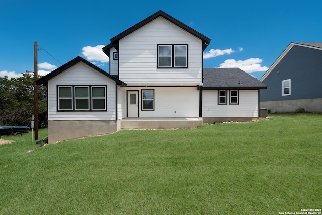122 Hi Vw, Lakehills, TX 78063 - back of house with a yard, covered porch, central AC unit, and roof with shingles