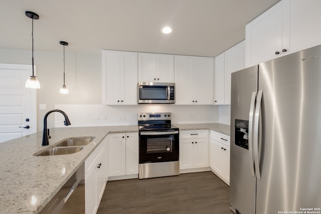 122 Hi Vw, Lakehills, TX 78063 - kitchen featuring appliances with stainless steel finishes, a sink, dark wood finished floors, white cabinets, and recessed lighting