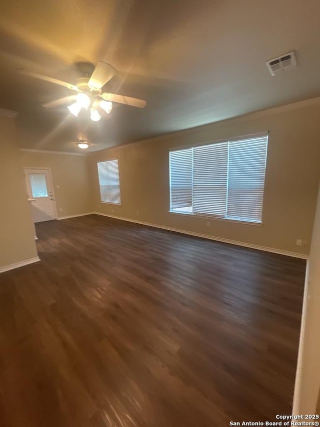 7126 Tourant, San Antonio, TX 78240 - unfurnished room featuring ornamental molding, visible vents, ceiling fan, dark wood-style floors, and baseboards