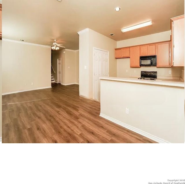 7126 Tourant, San Antonio, TX 78240 - kitchen with a peninsula, wood finished floors, ceiling fan, black appliances, and light countertops