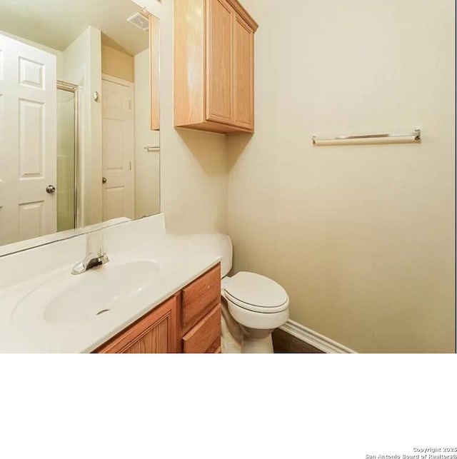 7126 Tourant, San Antonio, TX 78240 - full bath featuring baseboards, toilet, visible vents, vanity, and an enclosed shower