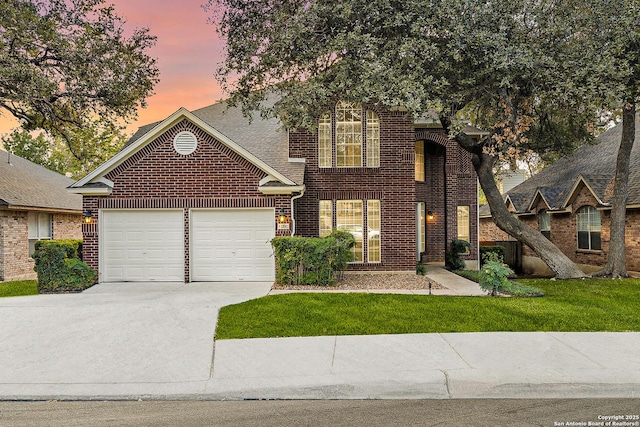 13911 Laurelbrook, San Antonio, TX 78249 - traditional-style house featuring brick siding, a front yard, driveway, and a garage