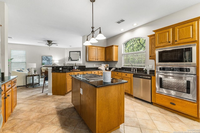 13911 Laurelbrook, San Antonio, TX 78249 - kitchen featuring a sink, a ceiling fan, a kitchen island, appliances with stainless steel finishes, and a peninsula