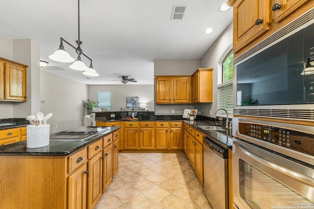 13911 Laurelbrook, San Antonio, TX 78249 - kitchen with a sink, appliances with stainless steel finishes, brown cabinets, visible vents, and ceiling fan