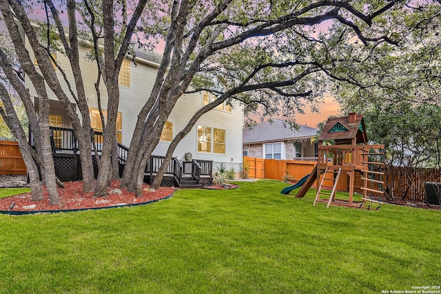 13911 Laurelbrook, San Antonio, TX 78249 - yard at dusk with a fenced backyard and a playground