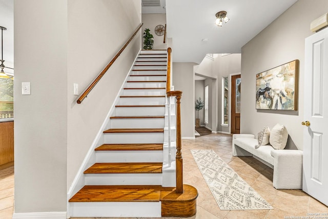 13911 Laurelbrook, San Antonio, TX 78249 - stairway featuring tile patterned floors, baseboards, and visible vents