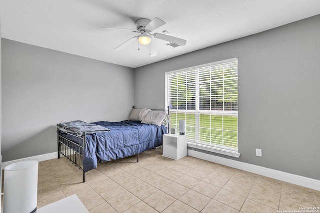 24704 Killarney St, Hempstead, TX 77445 - tiled bedroom with baseboards and a ceiling fan