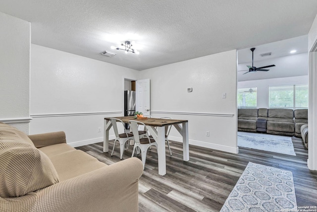 24704 Killarney St, Hempstead, TX 77445 - living room featuring wood finished floors, visible vents, a ceiling fan, and baseboards