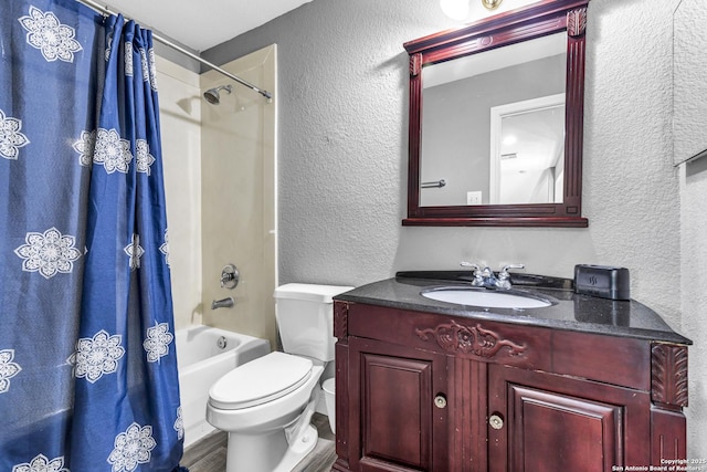 24704 Killarney St, Hempstead, TX 77445 - bathroom with toilet, wood finished floors, shower / bathtub combination with curtain, a textured wall, and vanity