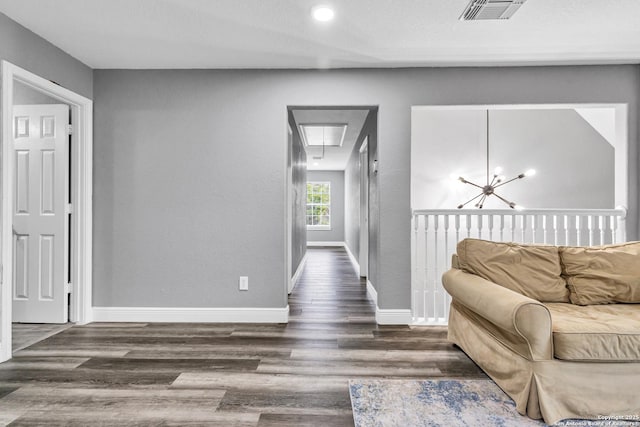 24704 Killarney St, Hempstead, TX 77445 - corridor featuring attic access, wood finished floors, visible vents, and baseboards