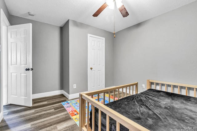 24704 Killarney St, Hempstead, TX 77445 - bedroom featuring ceiling fan, baseboards, and wood finished floors