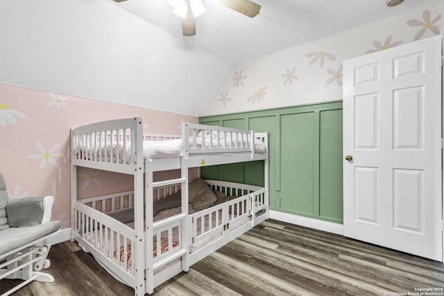 24704 Killarney St, Hempstead, TX 77445 - bedroom featuring wainscoting, lofted ceiling, wood finished floors, a decorative wall, and a nursery area