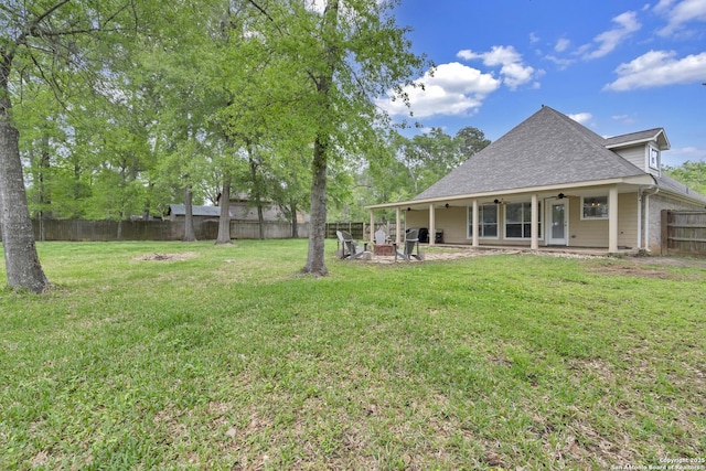 24704 Killarney St, Hempstead, TX 77445 - view of yard with a fenced backyard, a fire pit, a patio, and ceiling fan