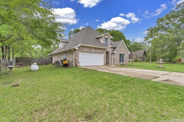 24704 Killarney St, Hempstead, TX 77445 - view of front facade featuring an attached garage, a shingled roof, a front yard, and fence