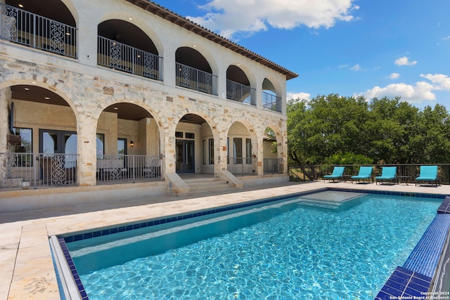 view of swimming pool with a fenced in pool, a patio, french doors, and fence