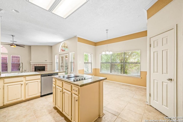 15338 Winter Mist Dr, San Antonio, TX 78247 - kitchen with a tiled fireplace, open floor plan, stainless steel dishwasher, ceiling fan with notable chandelier, and a sink