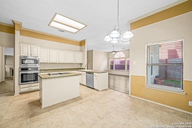 15338 Winter Mist Dr, San Antonio, TX 78247 - kitchen featuring crown molding, visible vents, a notable chandelier, and stainless steel appliances