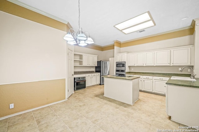 15338 Winter Mist Dr, San Antonio, TX 78247 - kitchen with a notable chandelier, a center island, crown molding, appliances with stainless steel finishes, and a sink