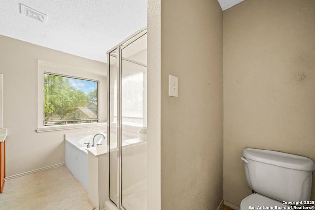 15338 Winter Mist Dr, San Antonio, TX 78247 - bathroom featuring a bath, a stall shower, visible vents, and a textured ceiling