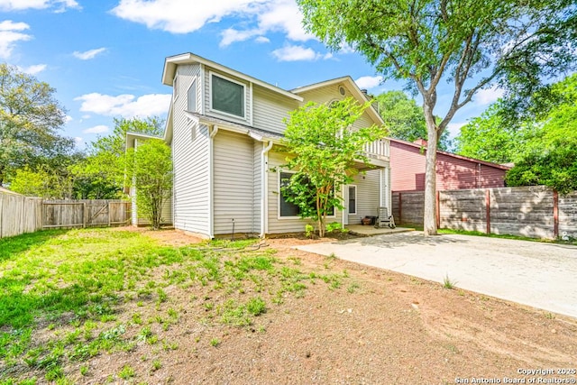 15338 Winter Mist Dr, San Antonio, TX 78247 - view of front of property featuring a fenced backyard, a front lawn, and a patio