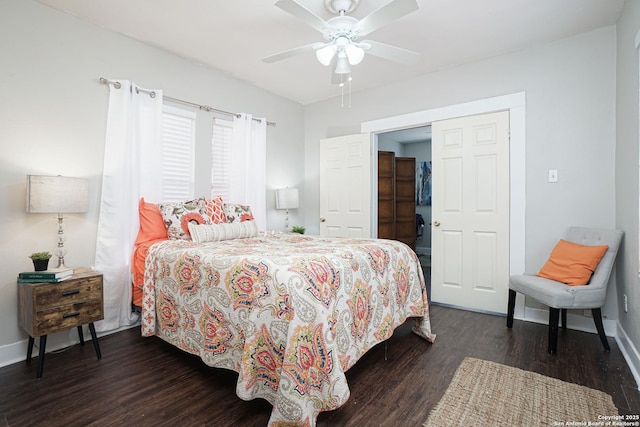 bedroom featuring baseboards, a ceiling fan, and dark wood finished floors
