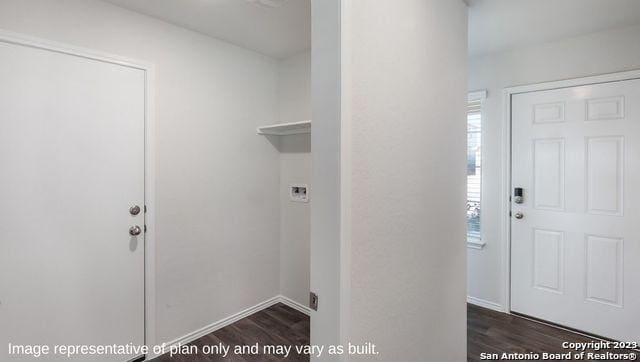 1506 Champagne Oak, New Braunfels, TX 78130 - washroom with laundry area, baseboards, and dark wood-type flooring