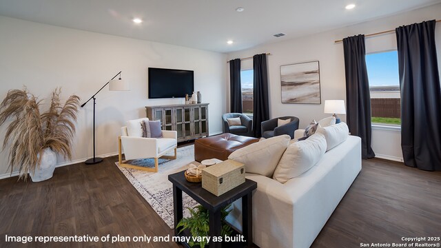731 Garnier Pass, San Antonio, TX 78221 - living room featuring dark wood-type flooring, baseboards, plenty of natural light, and recessed lighting