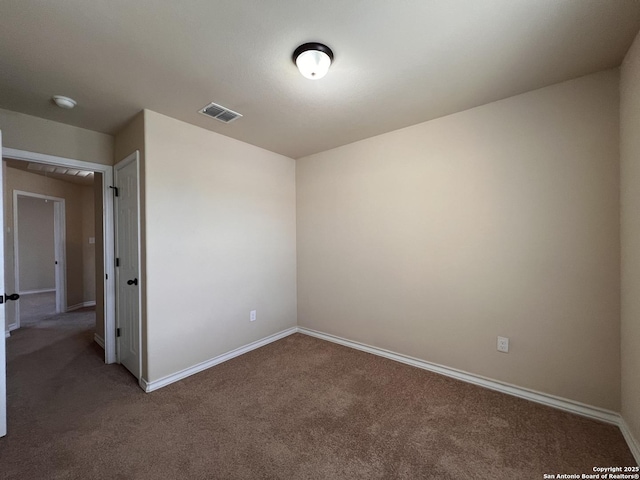 unfurnished bedroom featuring carpet flooring, baseboards, and visible vents