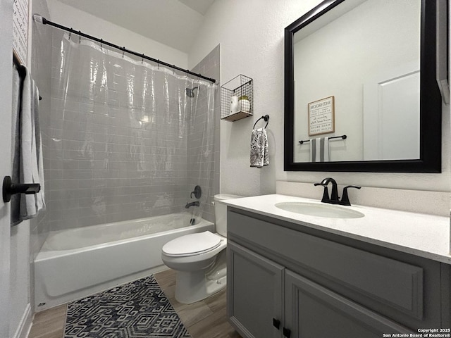12835 Fort Belknap, San Antonio, TX 78245 - full bathroom with shower / bath combo, vanity, toilet, and wood finished floors