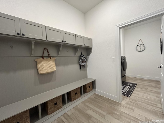 12835 Fort Belknap, San Antonio, TX 78245 - mudroom featuring washer / clothes dryer, light wood finished floors, and baseboards