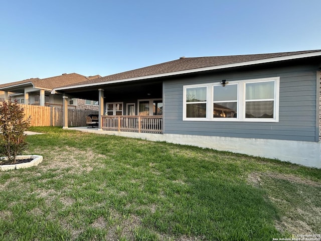 12835 Fort Belknap, San Antonio, TX 78245 - rear view of house featuring a yard, fence, and a patio