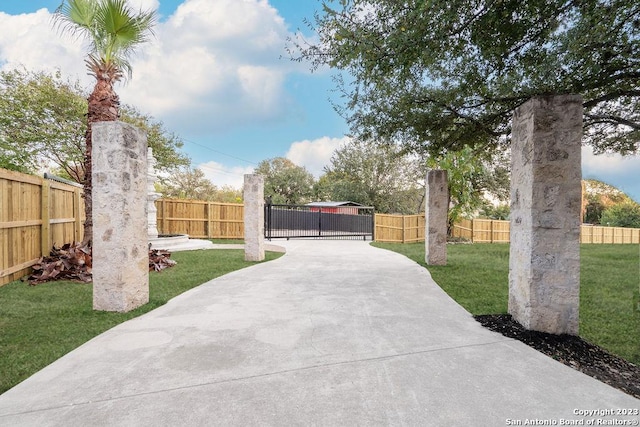4935 Driskill St, San Antonio, TX 78228 - view of gate featuring a yard and fence private yard