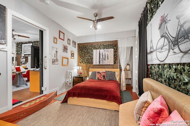 4935 Driskill St, San Antonio, TX 78228 - bedroom featuring baseboards, a ceiling fan, and wood finished floors