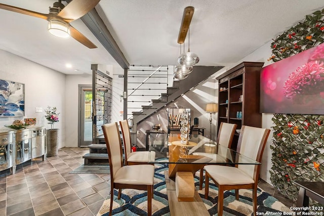 4935 Driskill St, San Antonio, TX 78228 - dining space featuring stairs, a textured ceiling, beamed ceiling, and ceiling fan