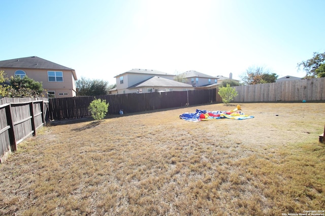 view of yard featuring a fenced backyard