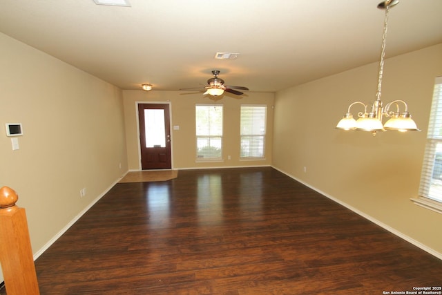 foyer featuring visible vents, baseboards, wood finished floors, and ceiling fan with notable chandelier
