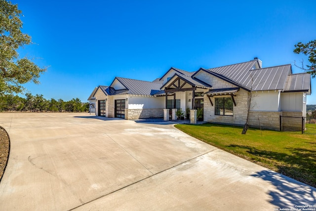 112 Chinkapin, Boerne, TX 78006 - view of front of house with a standing seam roof, metal roof, driveway, and stone siding