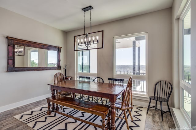 112 Chinkapin, Boerne, TX 78006 - dining area featuring a wealth of natural light, an inviting chandelier, and wood finished floors