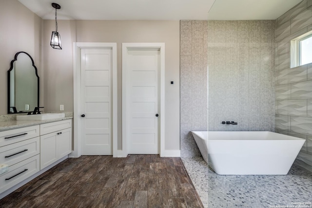 112 Chinkapin, Boerne, TX 78006 - bathroom with a freestanding bath, vanity, and wood finished floors