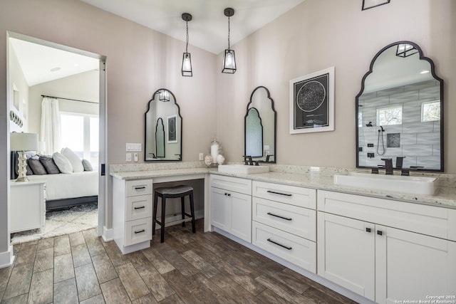 112 Chinkapin, Boerne, TX 78006 - full bath featuring a sink, wood finished floors, and vaulted ceiling