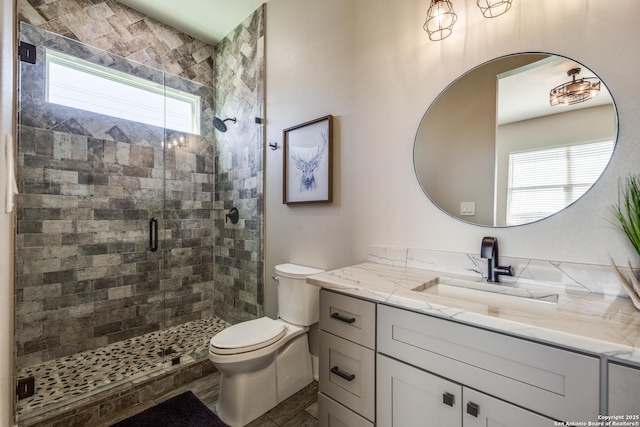 112 Chinkapin, Boerne, TX 78006 - bathroom featuring a shower stall, vanity, and toilet