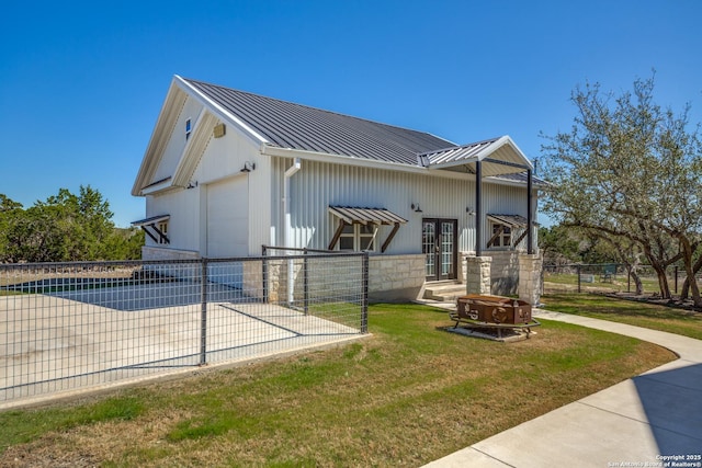 112 Chinkapin, Boerne, TX 78006 - view of property exterior with driveway, stone siding, a yard, metal roof, and fence