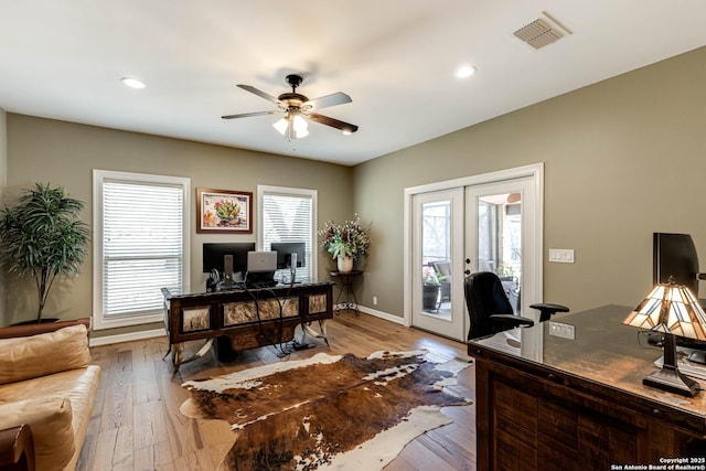 office with baseboards, french doors, a ceiling fan, visible vents, and hardwood / wood-style flooring