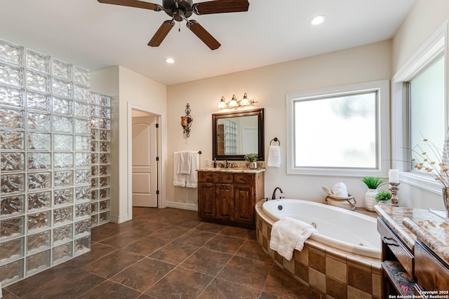 full bath featuring a whirlpool tub, vanity, recessed lighting, walk in shower, and a ceiling fan