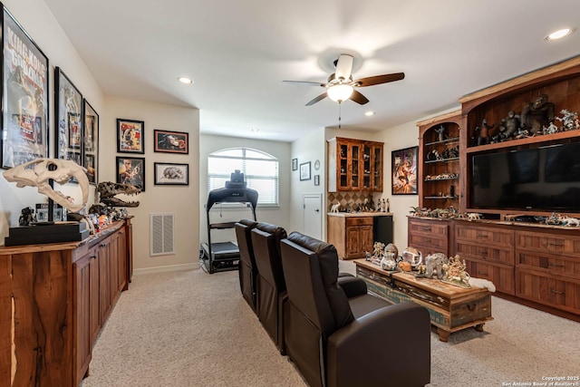 living area featuring ceiling fan, visible vents, recessed lighting, a bar, and light carpet